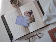 The 'Boné Borahae' resting on a desk next to BTS albums and fan letters.