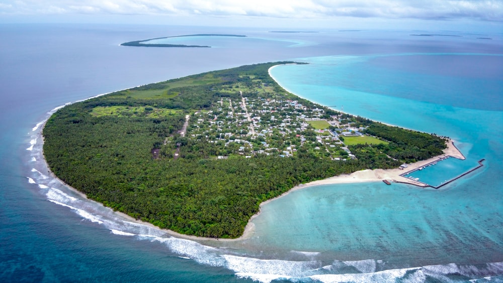 an aerial view of a small island in the middle of the ocean