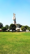 A large outdoor sculpture in a serene park.
