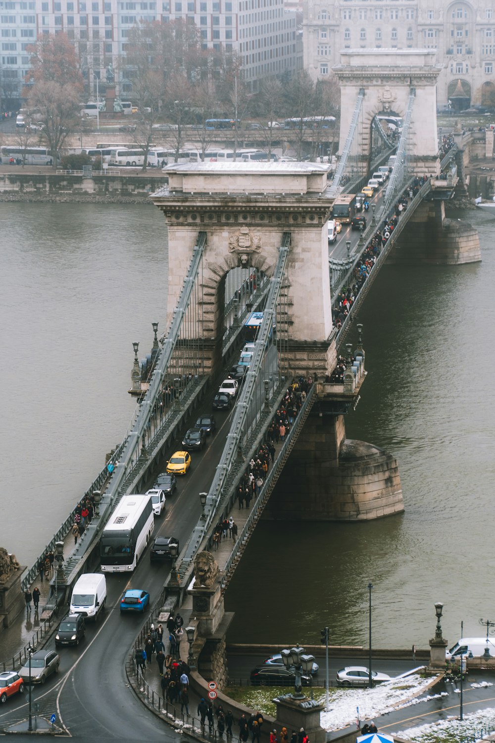 people walking on bridge during daytime