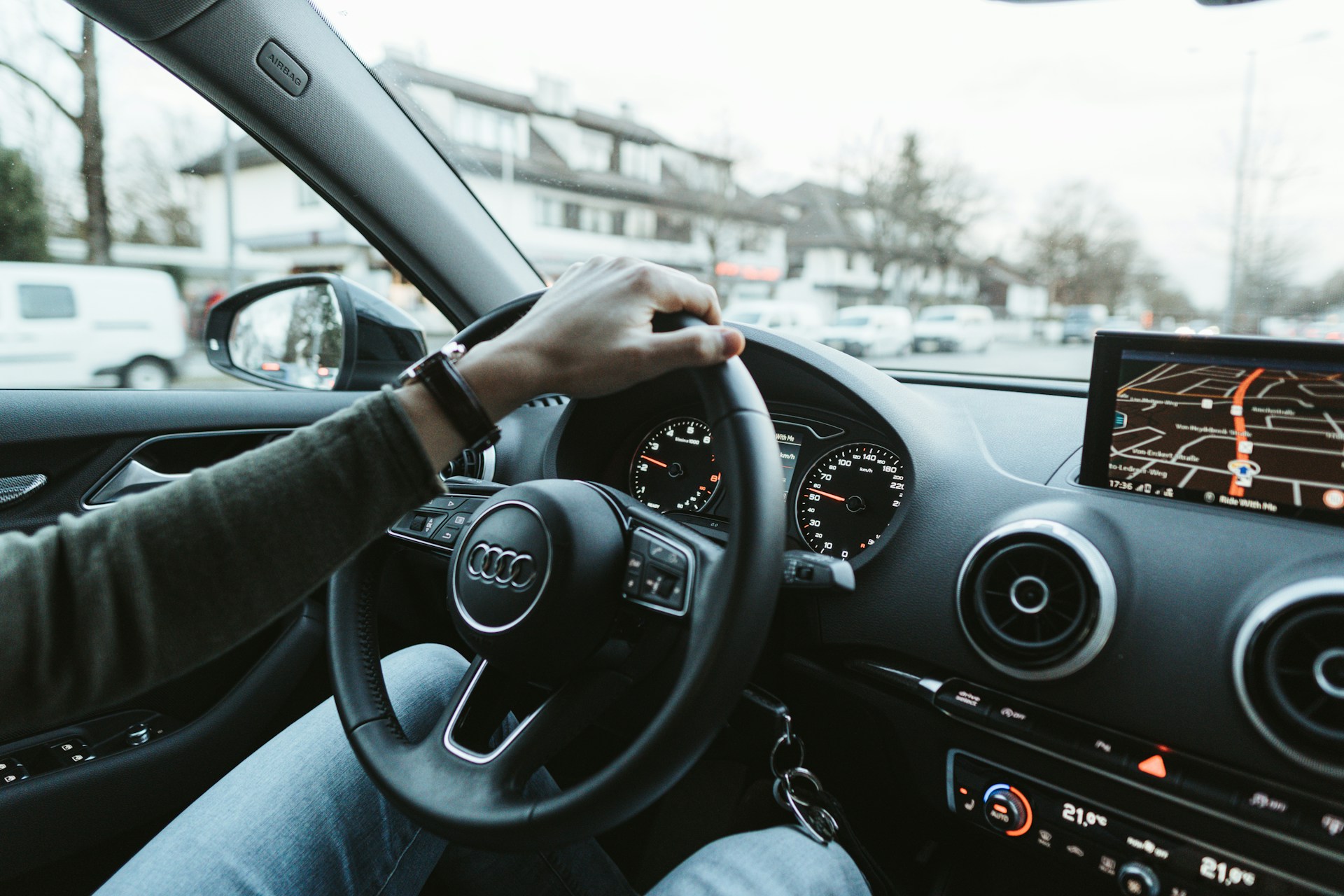 person driving car during daytime