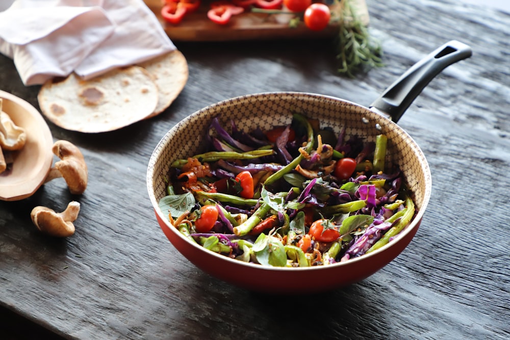 vegetable salad in red ceramic bowl