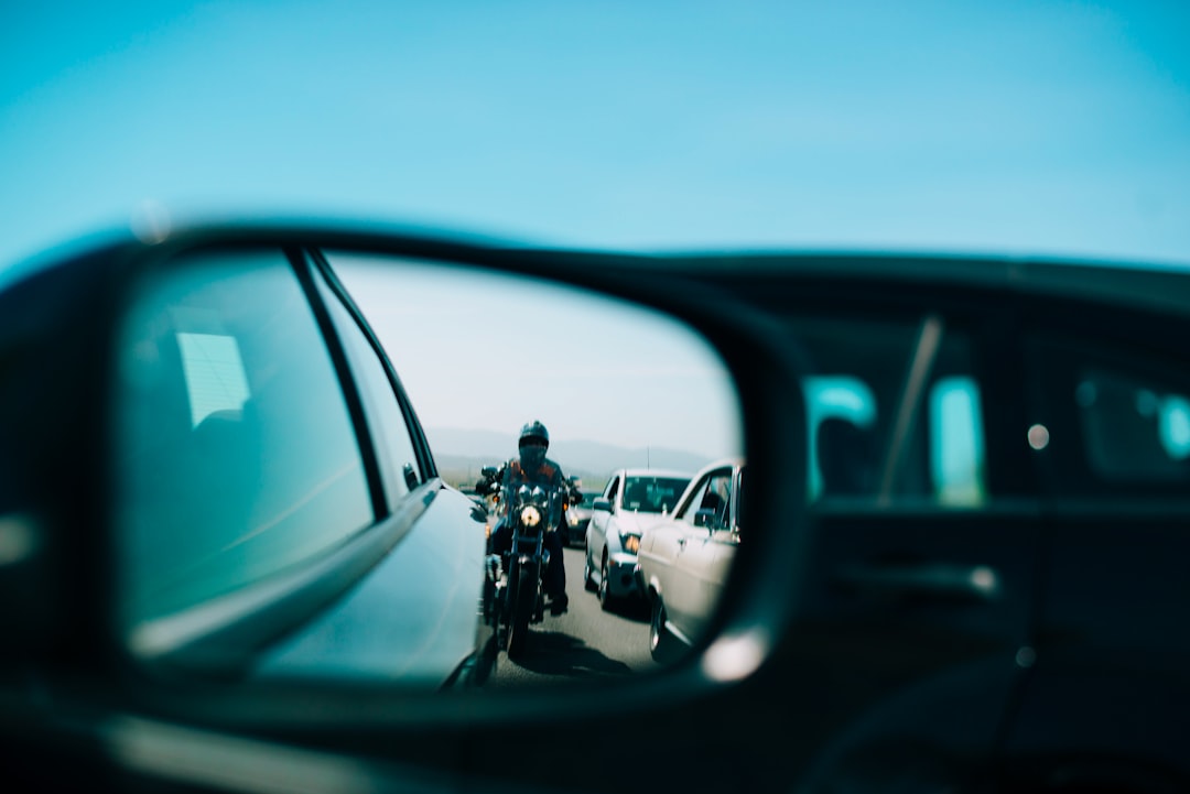 man in black jacket riding motorcycle during daytime