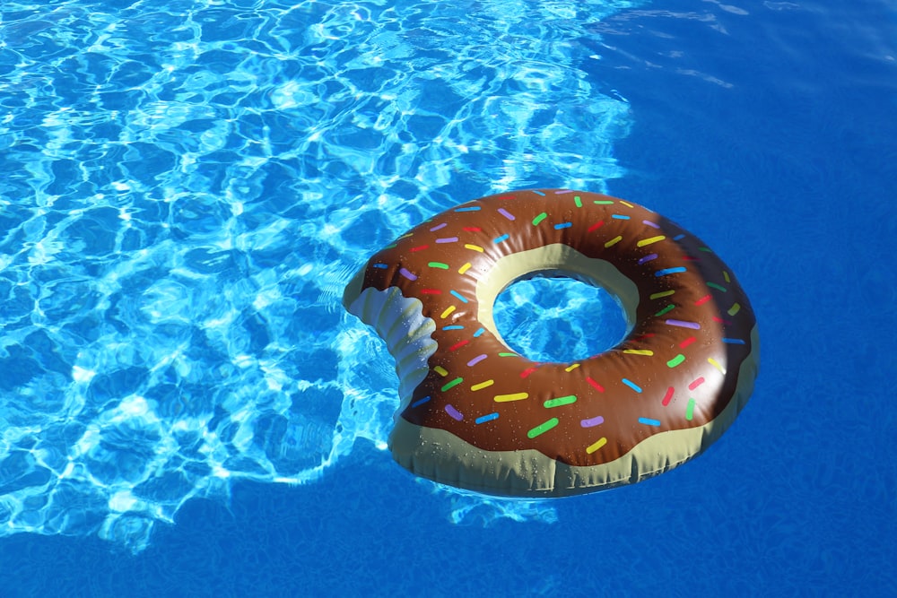 pink inflatable ring on blue water