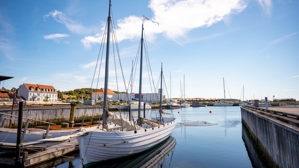 white boat on body of water during daytime