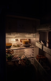 white refrigerator with food inside