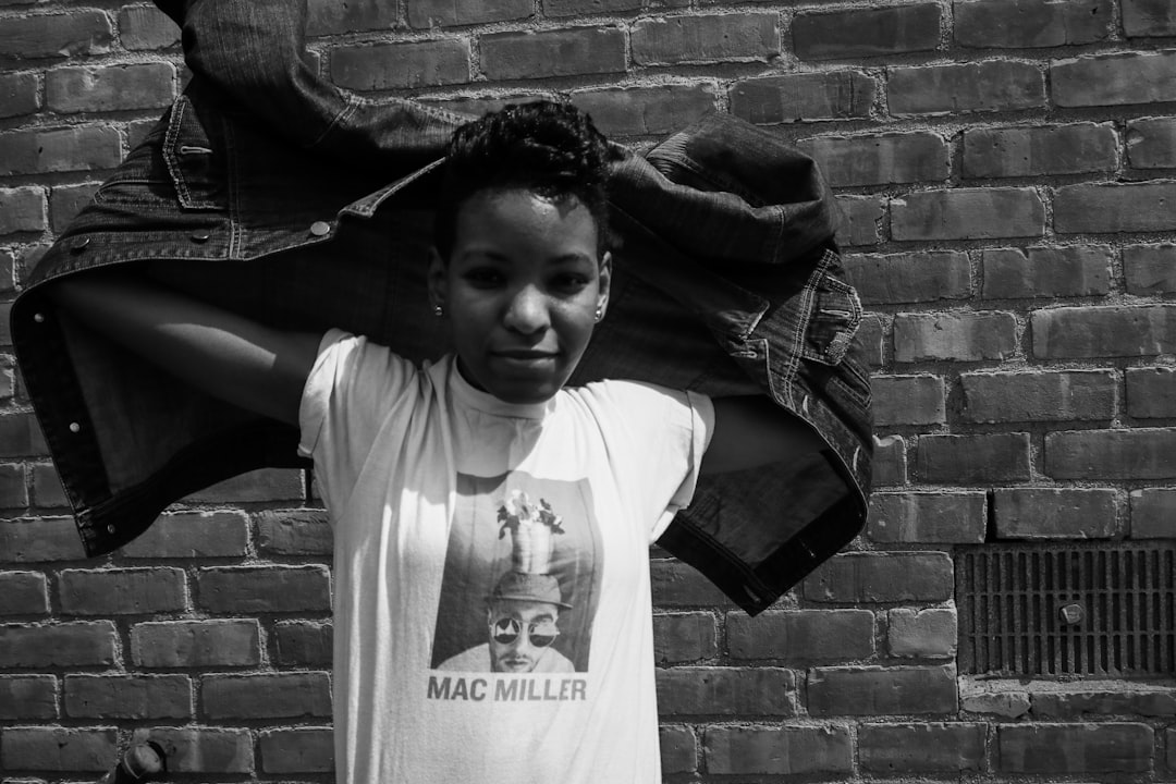 grayscale photo of girl in crew neck t-shirt