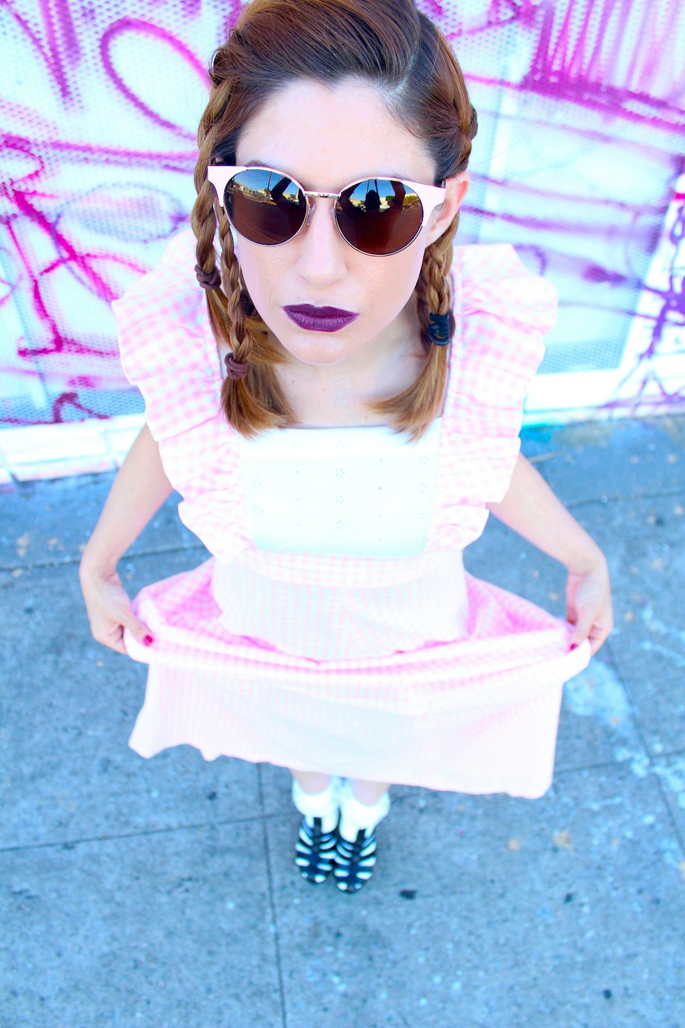 woman in blue and white checkered dress shirt wearing sunglasses