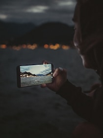 person holding black android smartphone