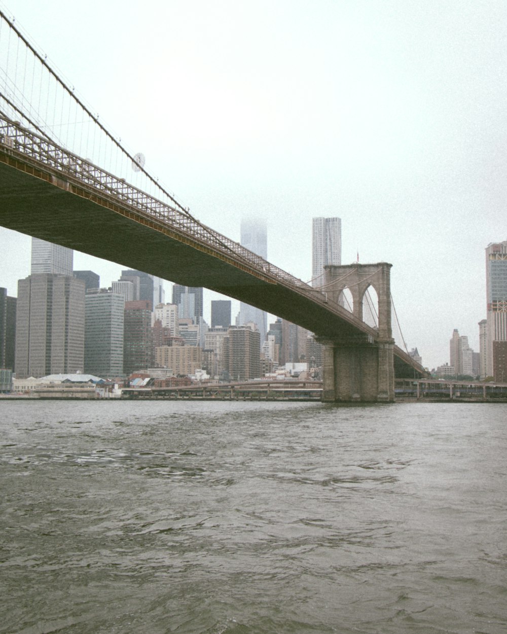 brown bridge over water during daytime