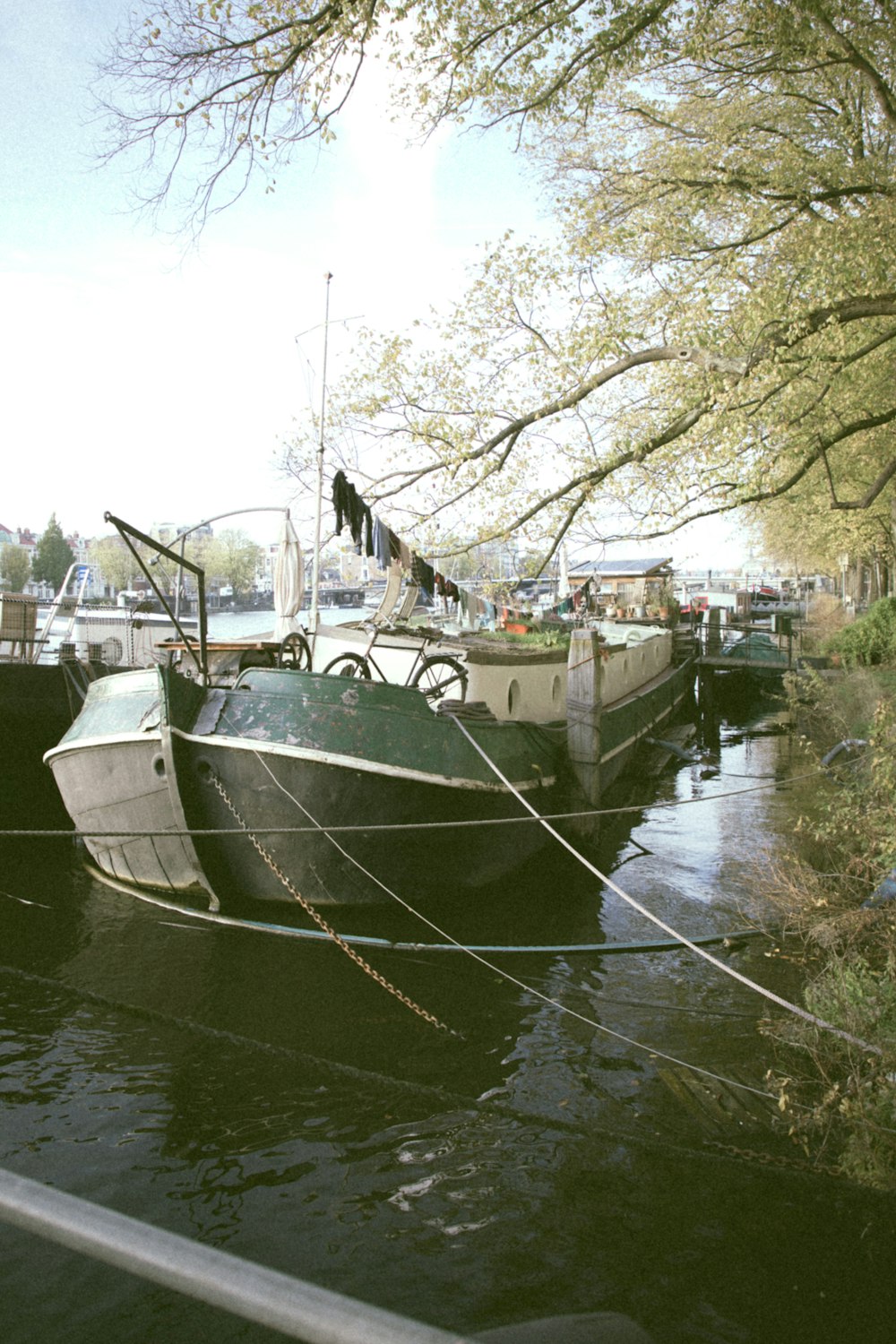 white and black boat on river during daytime