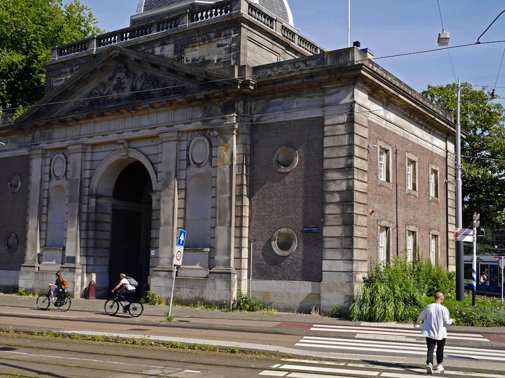 people walking near brown concrete building during daytime