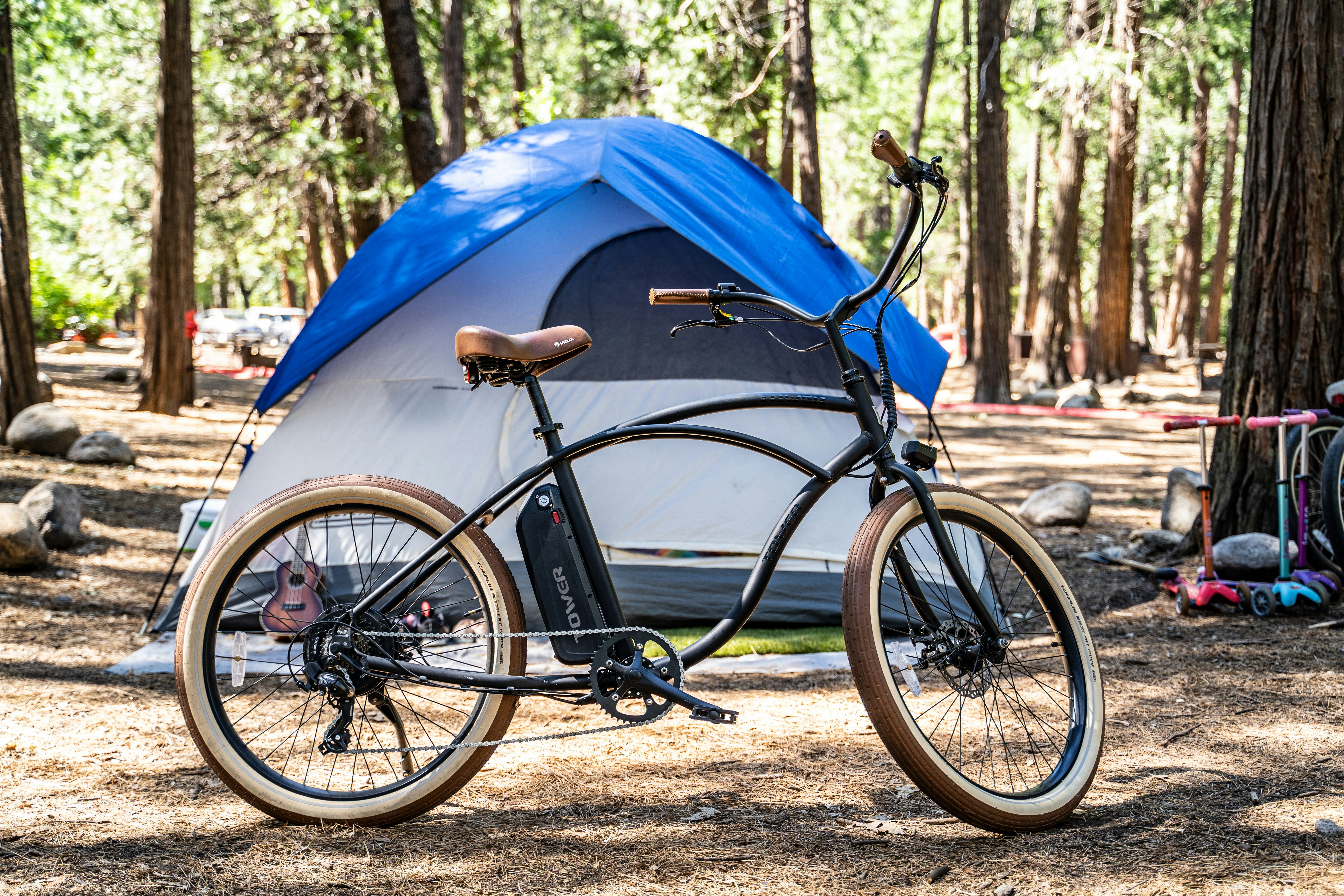 black bicycle beside blue tent