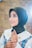 woman in blue hijab smiling