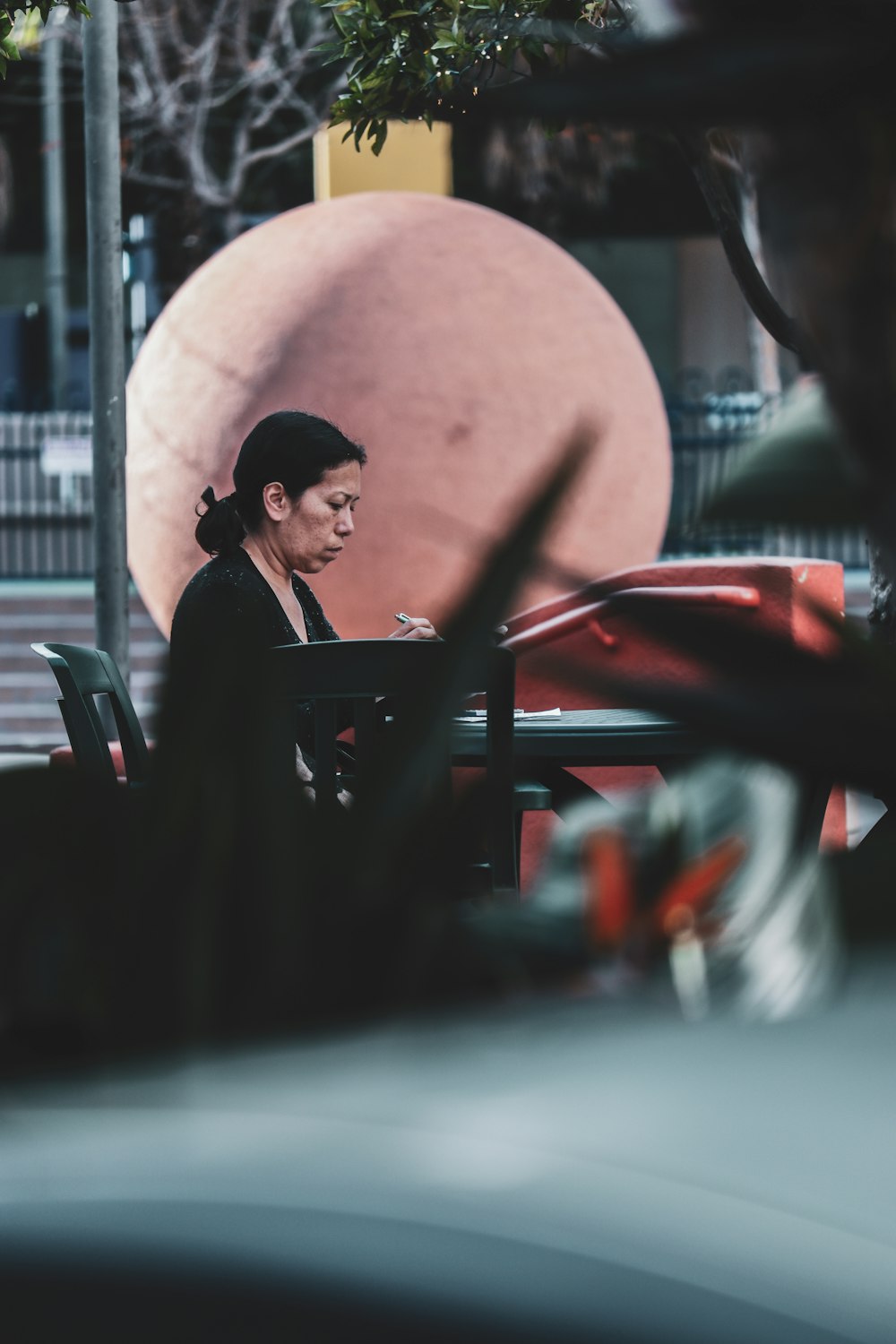 man in black suit jacket sitting on chair