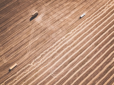 Aerial view of a farm being serviced by agricultural drones.