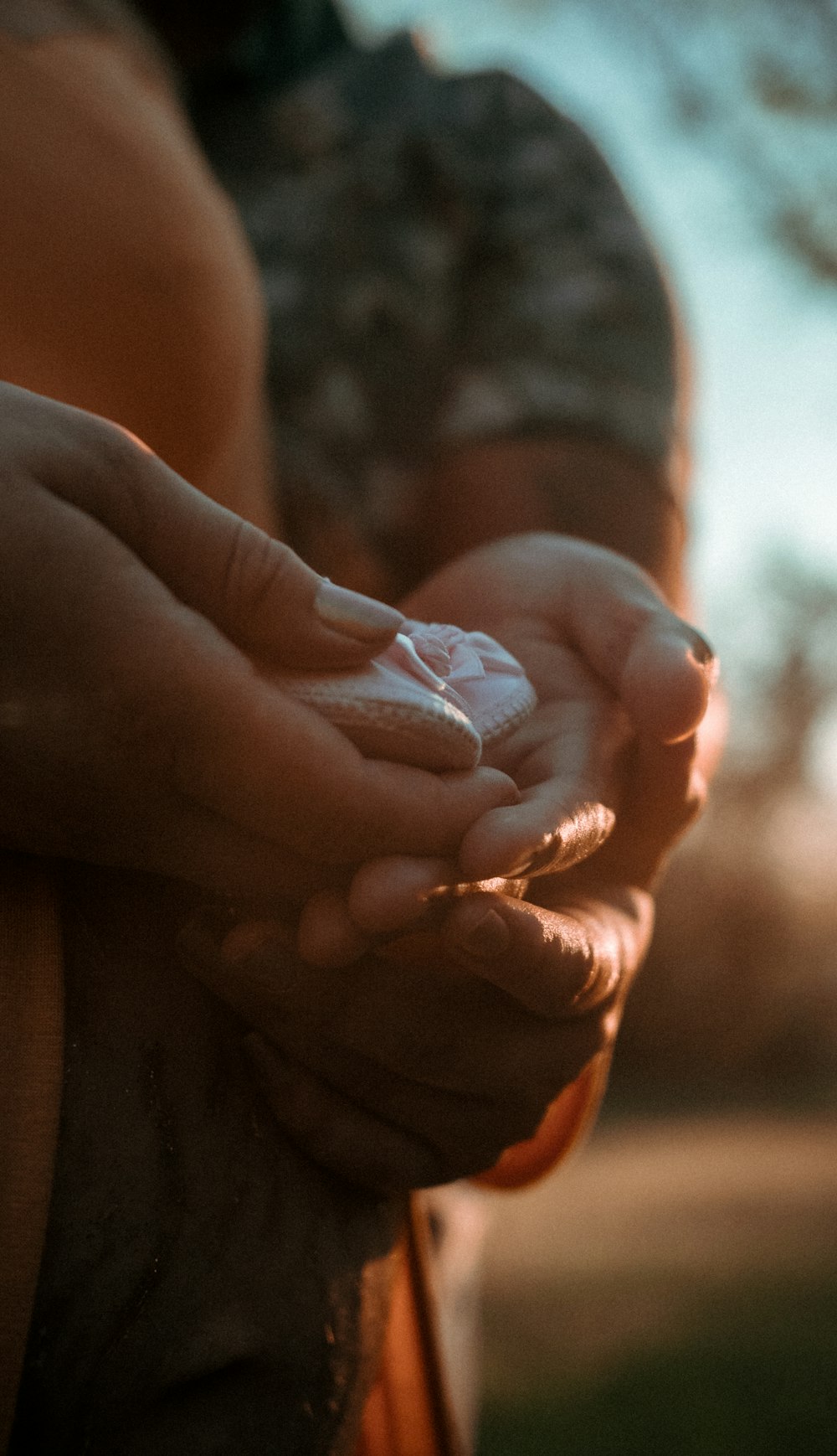 person holding babys hand