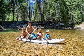 Health Vibes - Paddle a canoe with family down a lazy river for a fun activity