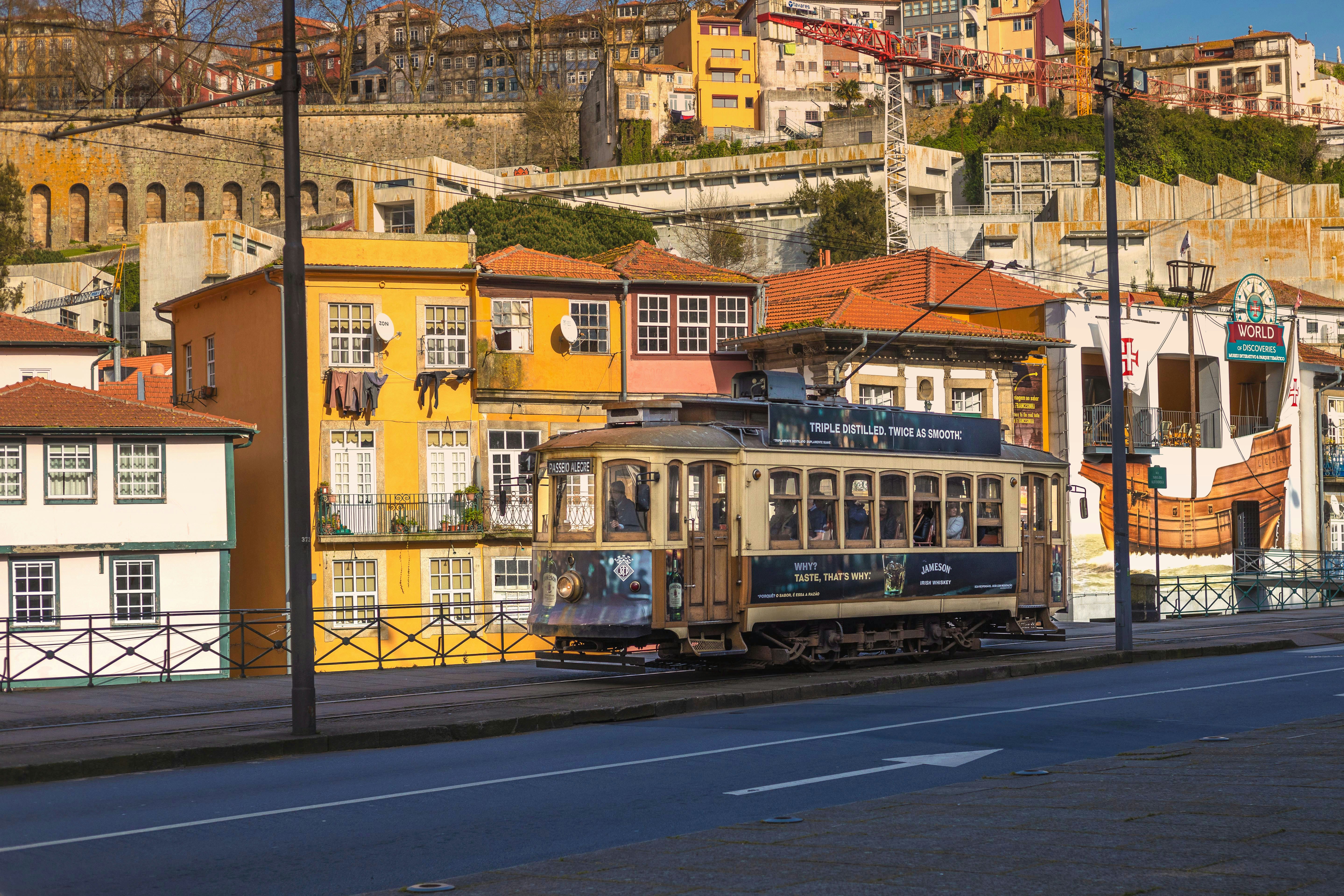 yellow and brown concrete building beside road during daytime