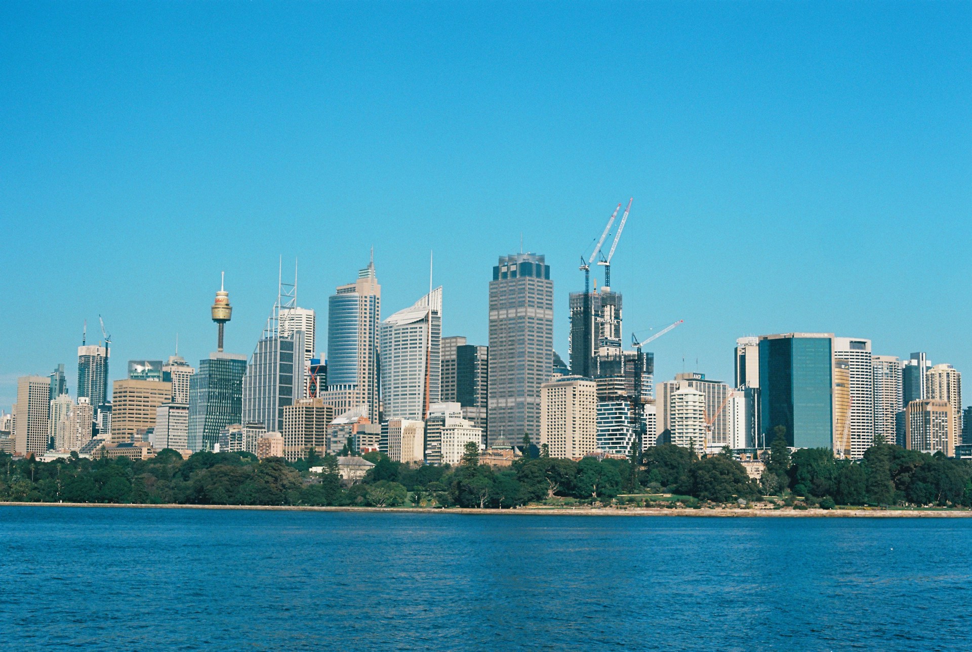 city skyline across body of water during daytime