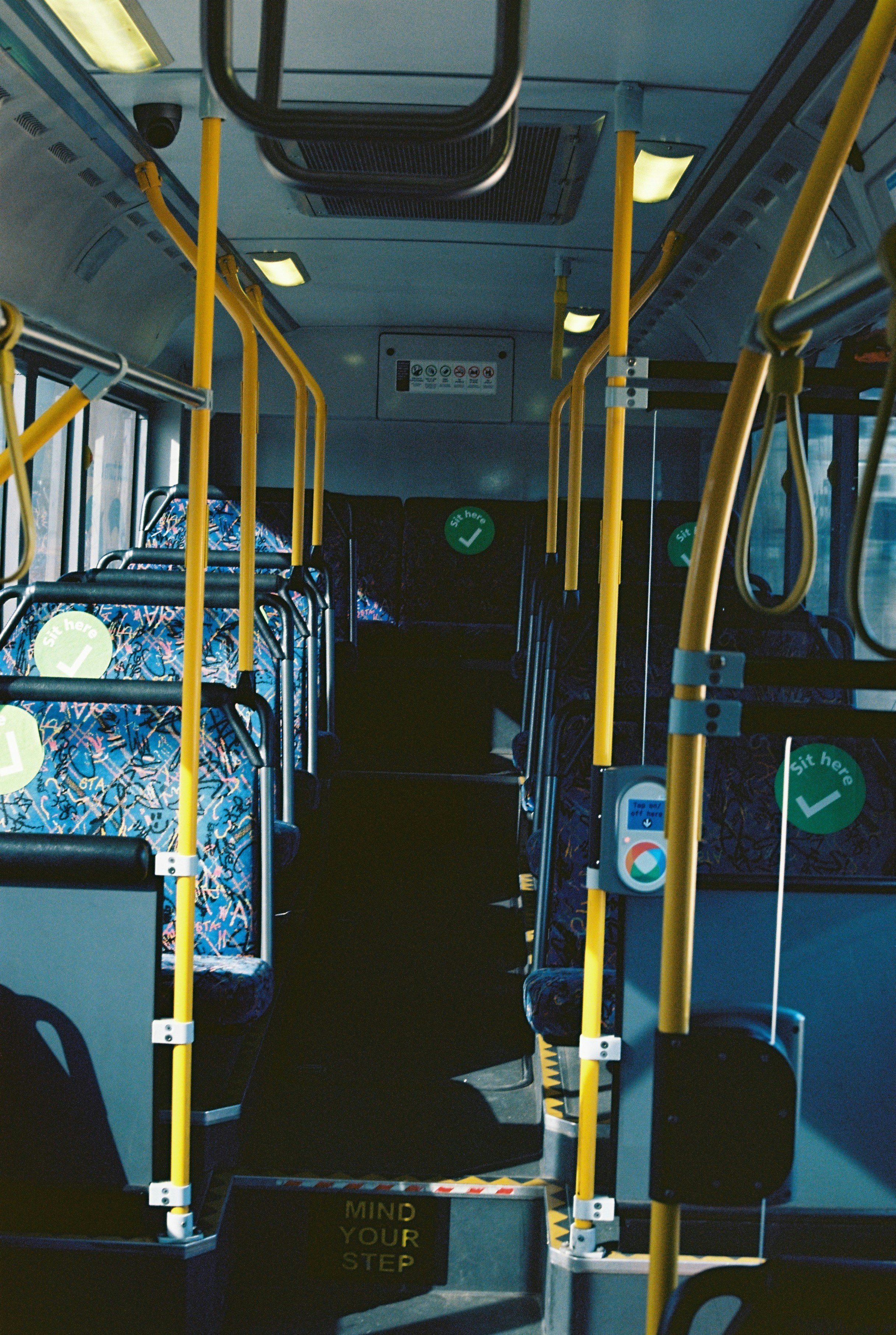Inside view of a luxurious bus with plush seats and ambient lighting