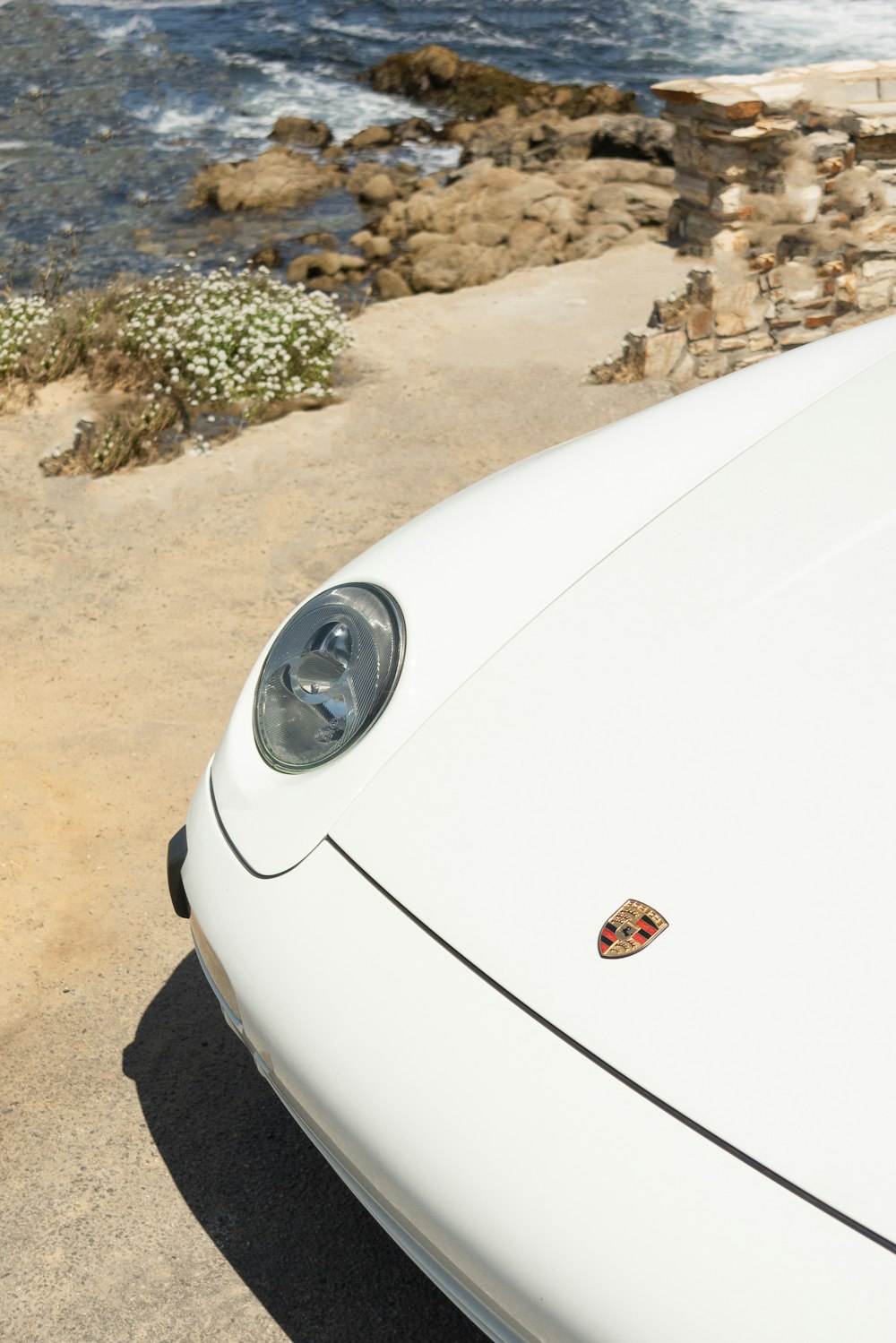 white car on brown dirt ground during daytime