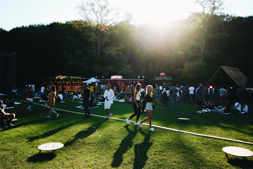 Community gathering outdoors, sharing moments in a peaceful, green environment.