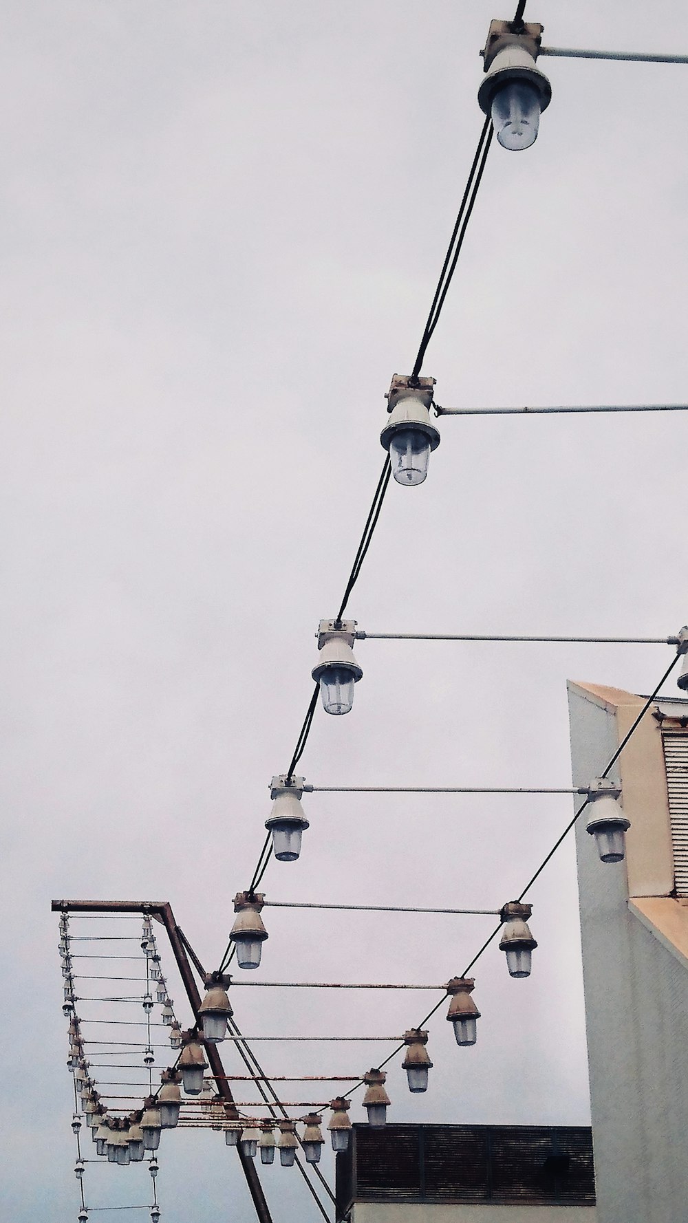 black cable cars under gray sky