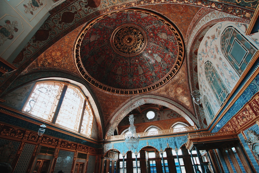 the ceiling of a building with many windows