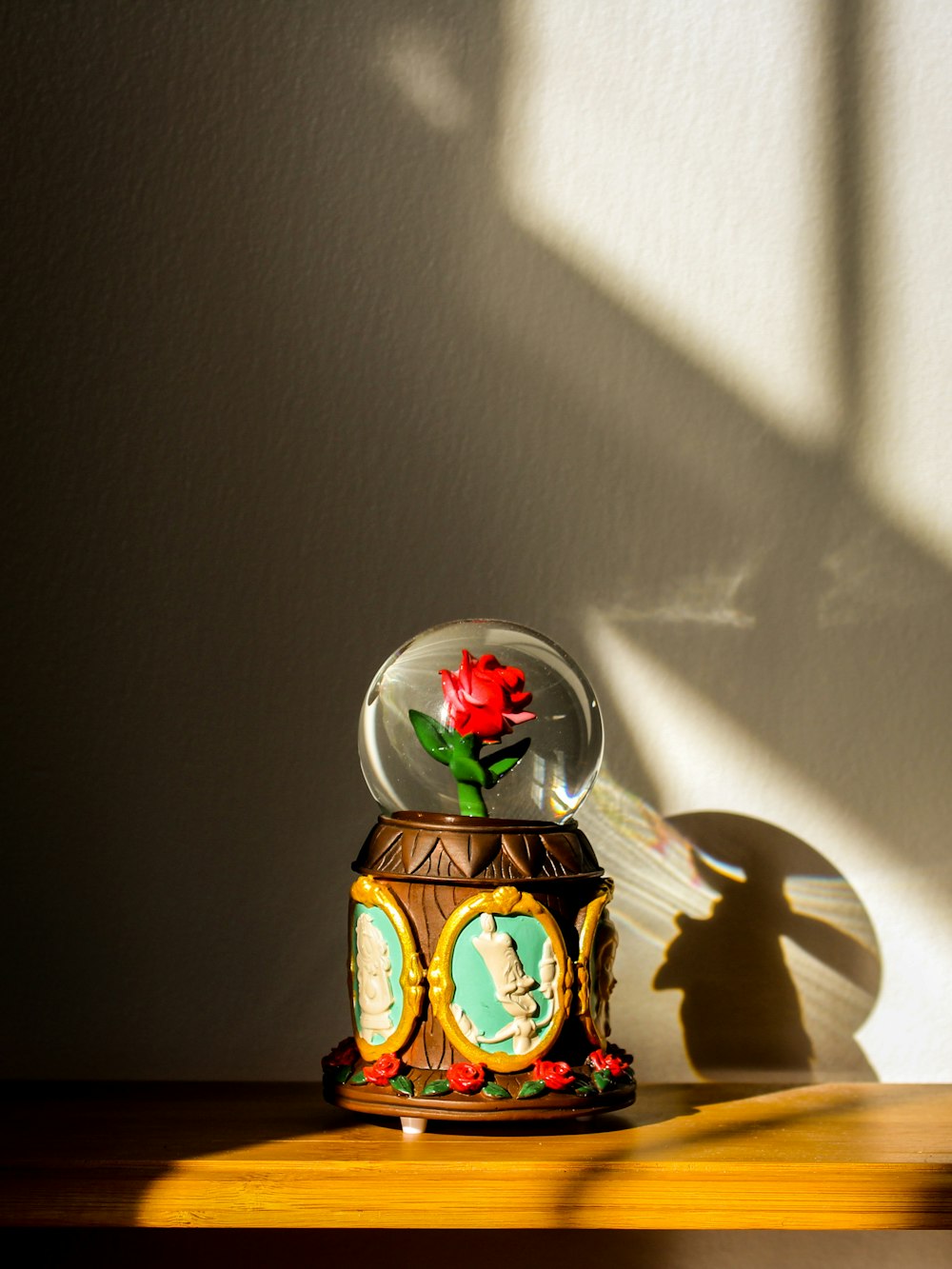 clear glass ball with snow man and woman print