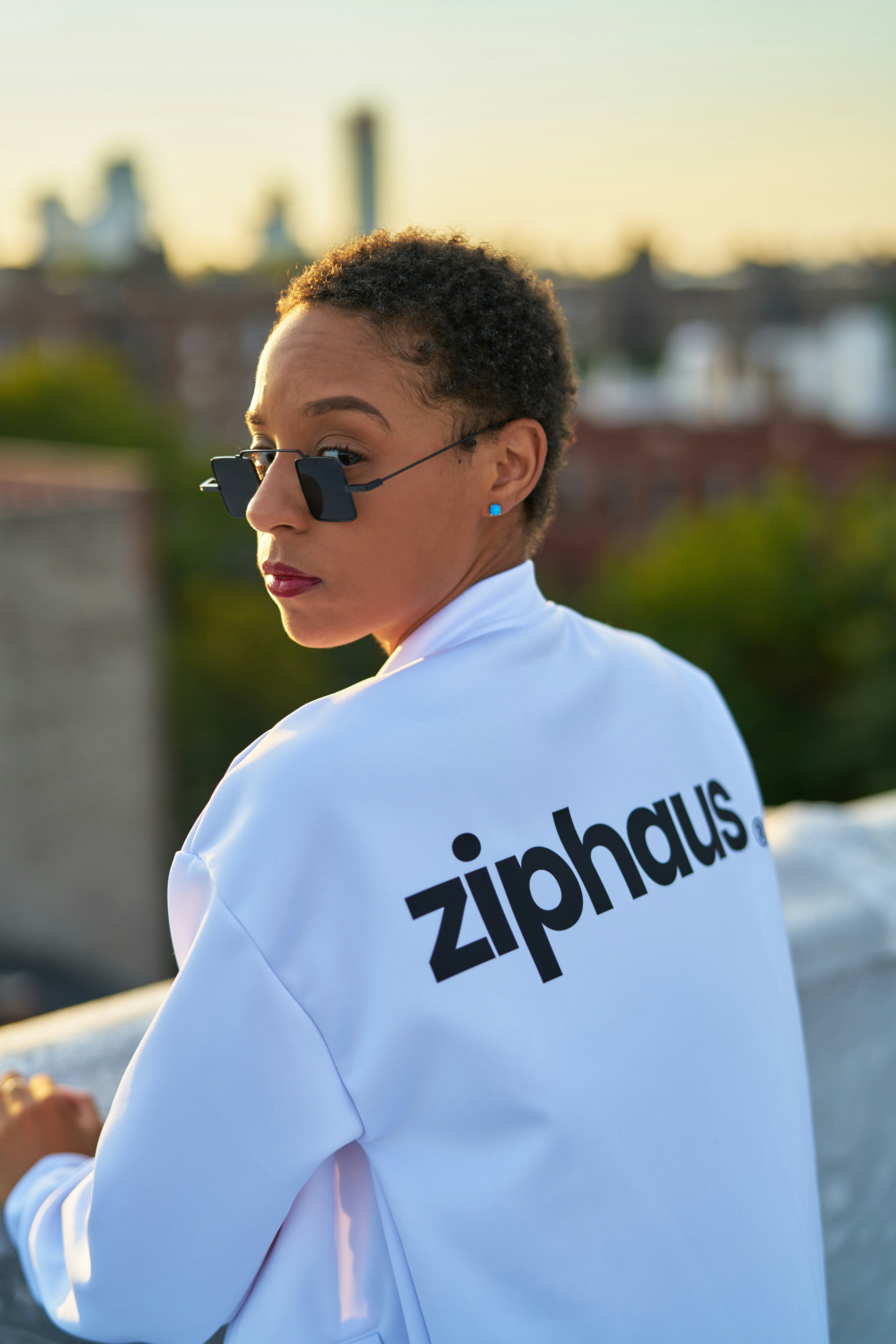 man in white crew neck shirt wearing black sunglasses