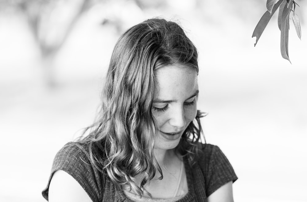 grayscale photo of woman in scoop neck shirt