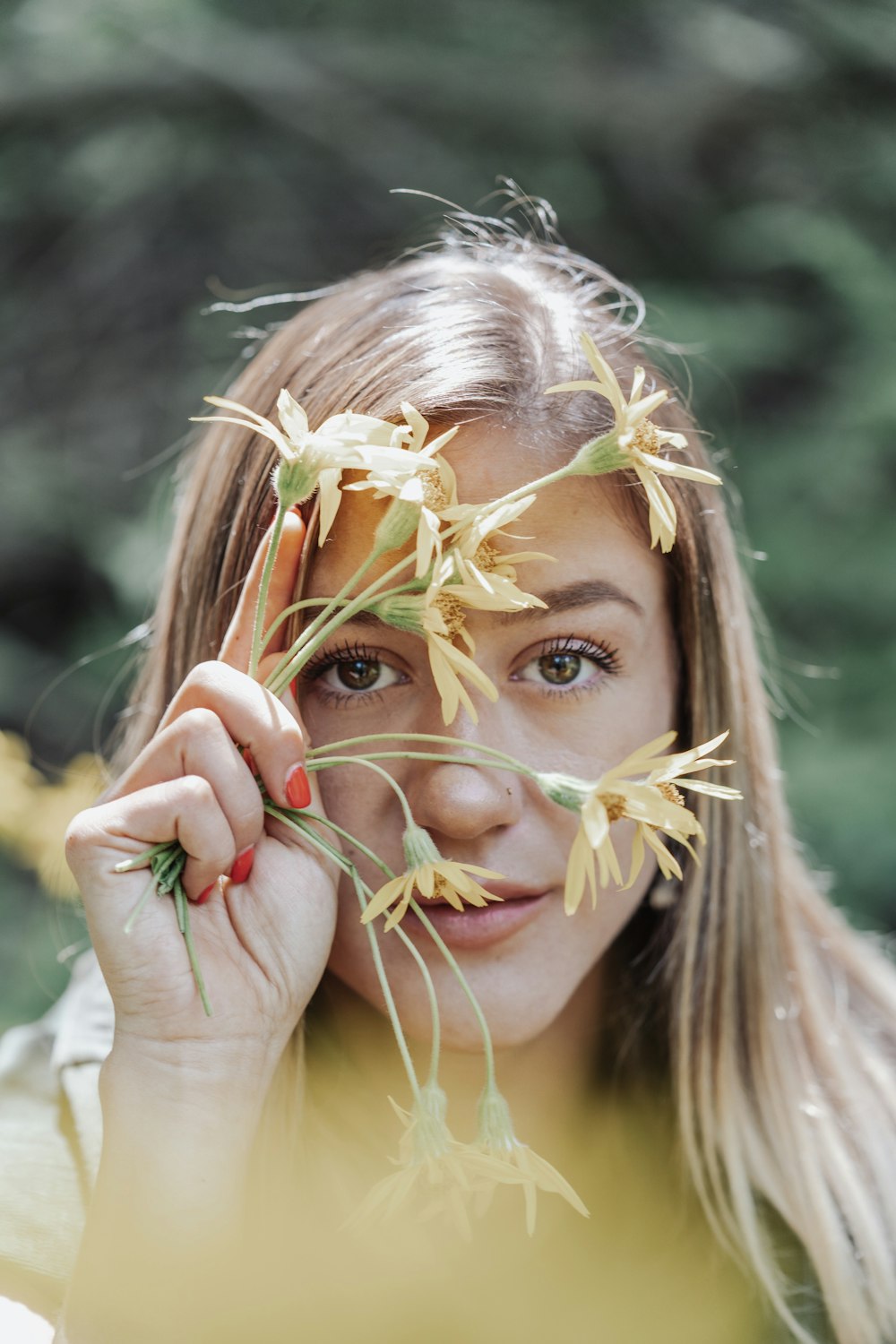 woman in white shirt with white flower on her hair