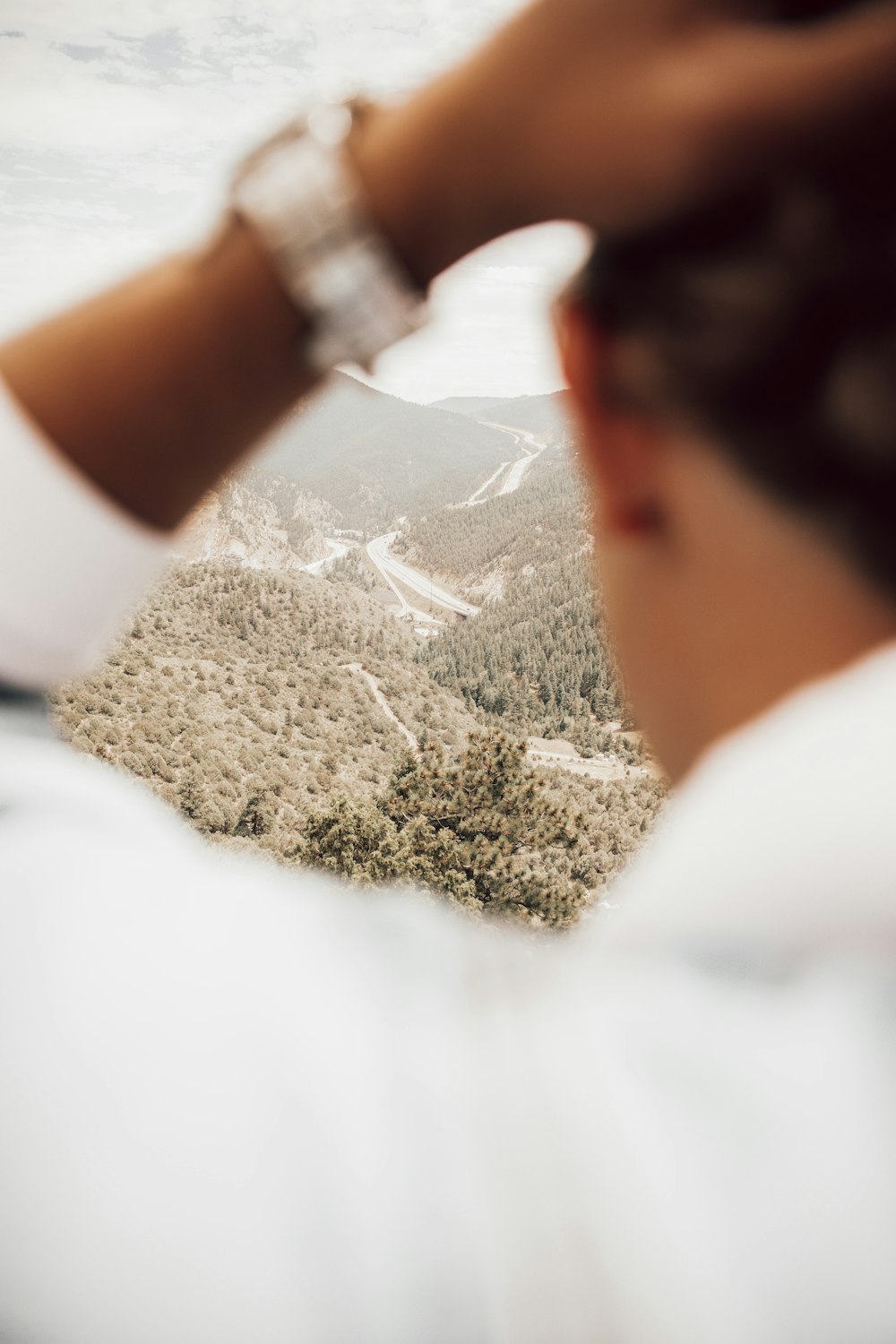 man in white shirt wearing silver watch