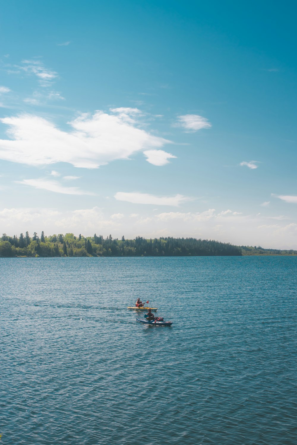 people riding on boat on sea during daytime