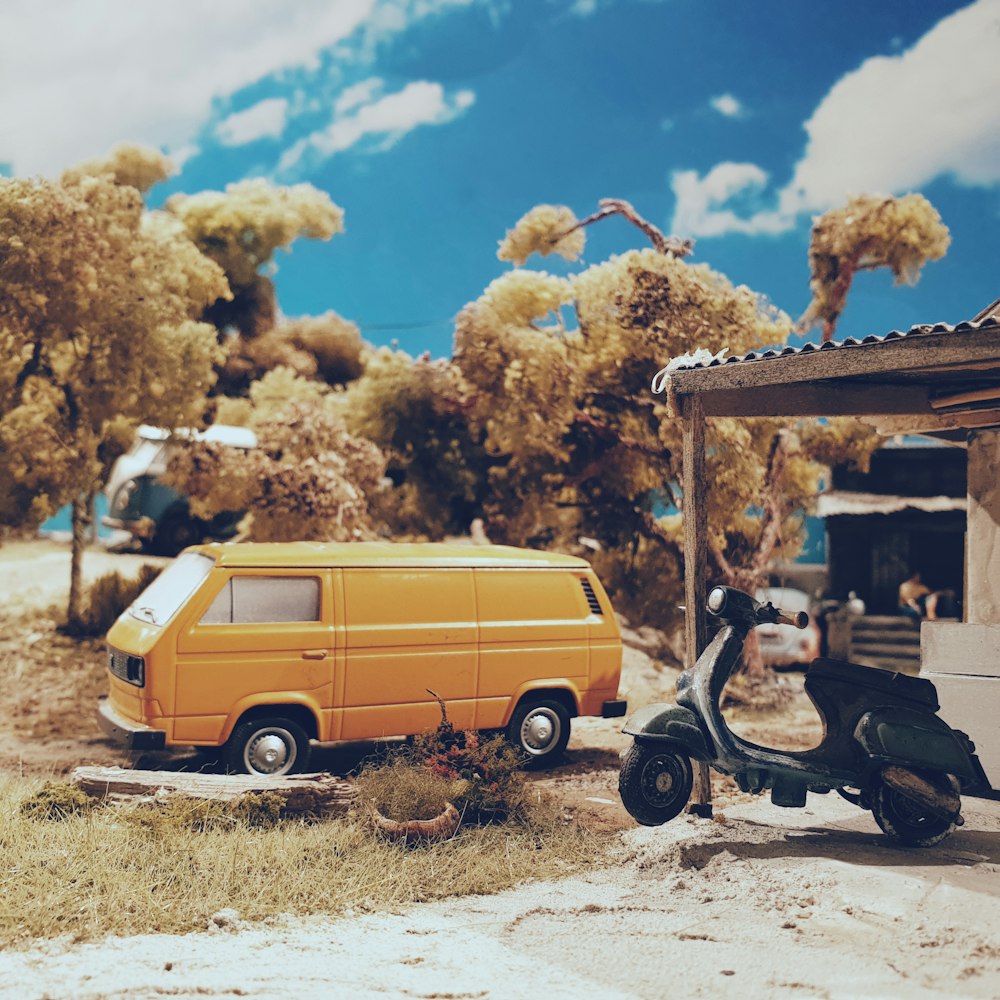 yellow van parked beside black stroller during daytime