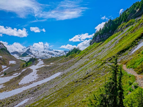 A picturesque mountain landscape with snow-capped peaks.