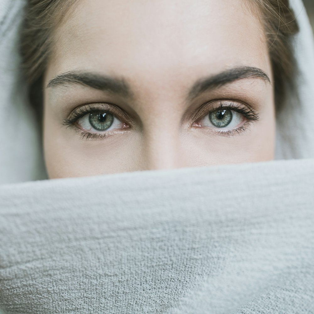 woman covered with white textile