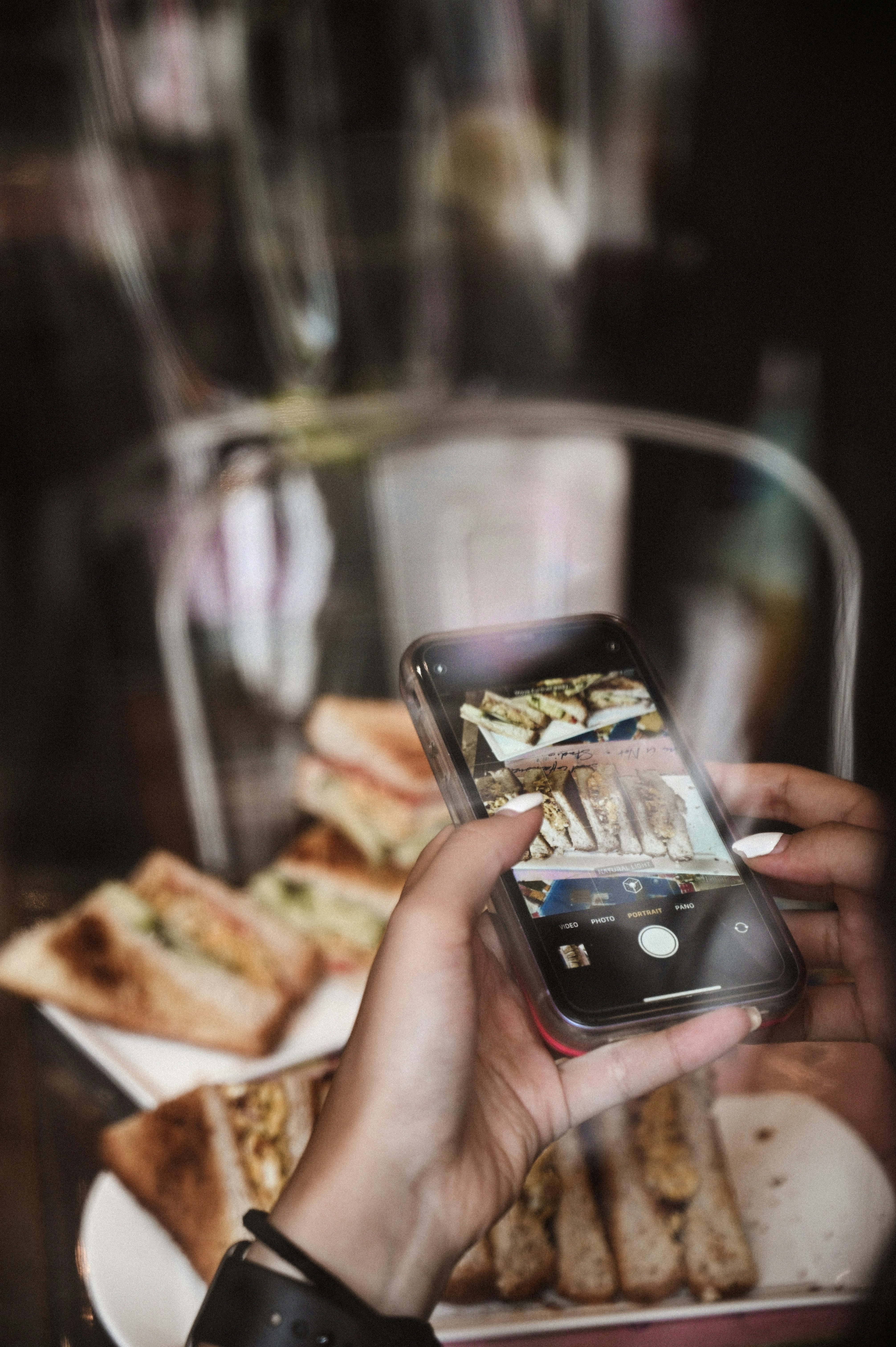 person holding silver iphone 6