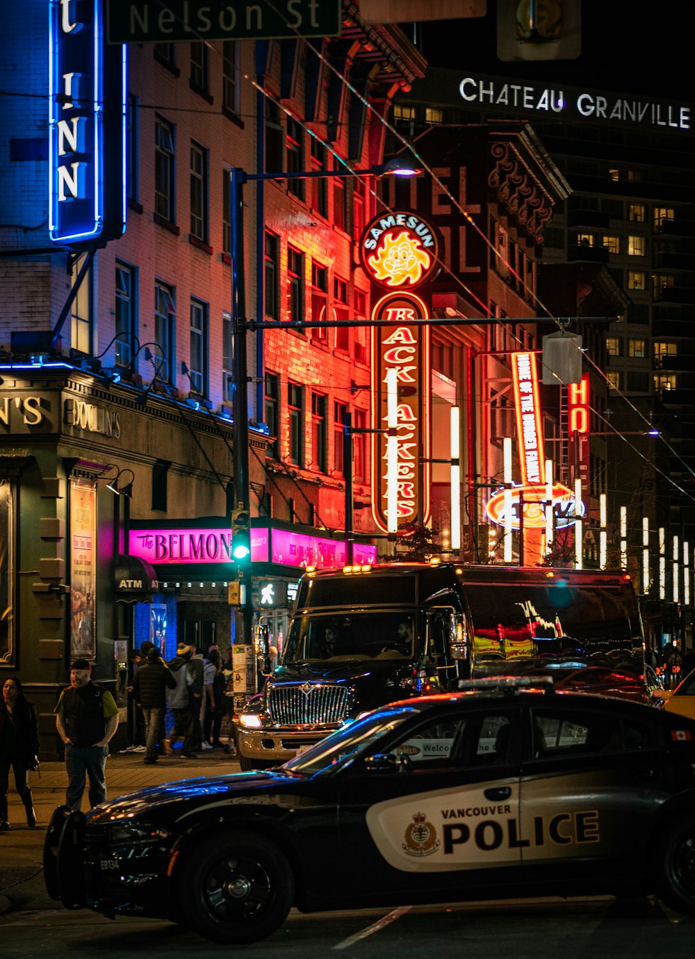 people walking on street during night time