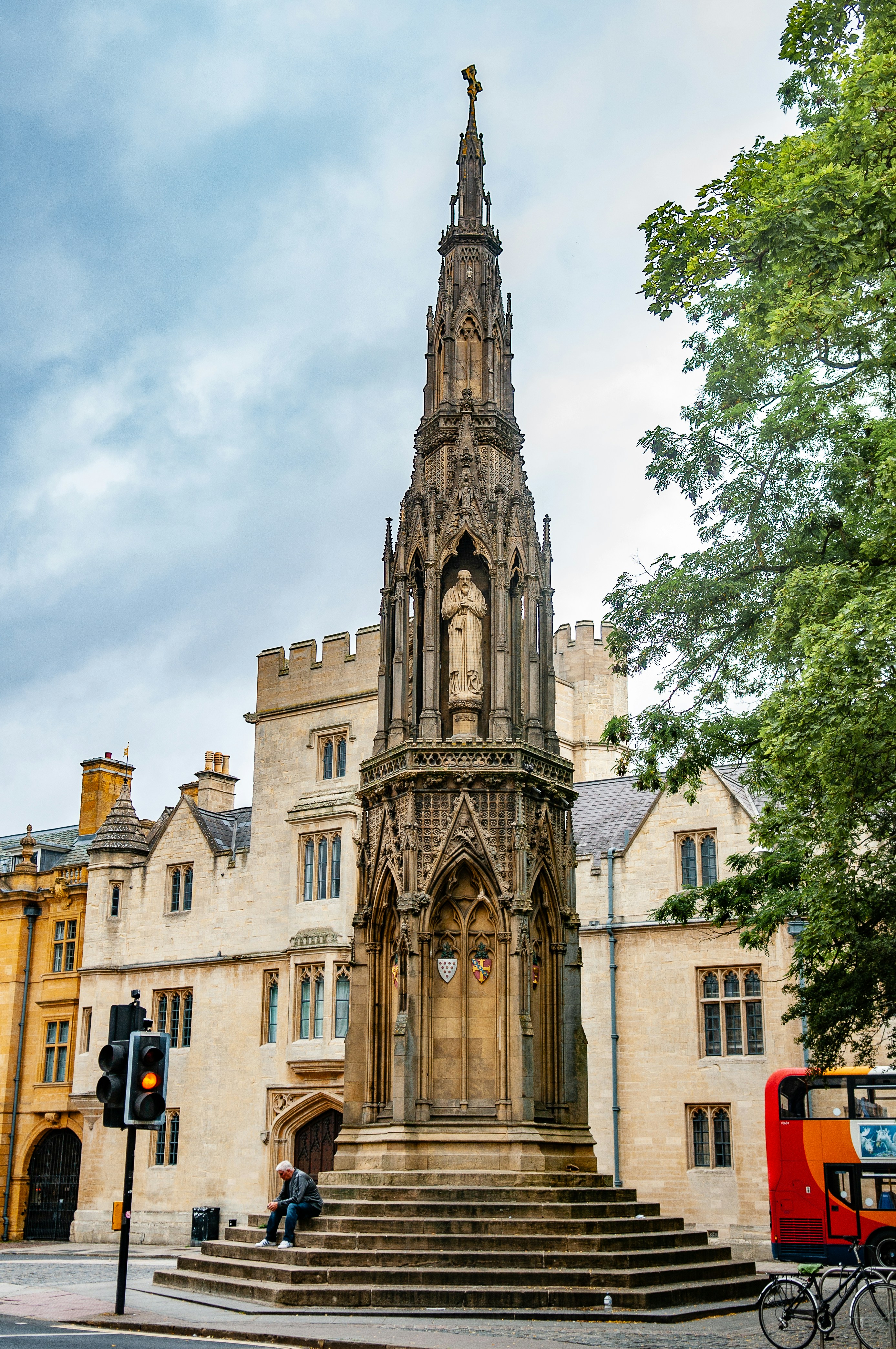 brown concrete building near green trees during daytime