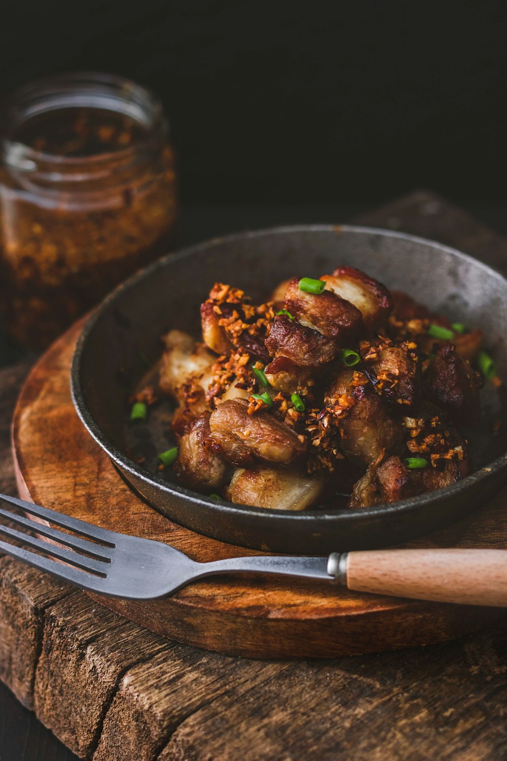 cooked meat on black round plate