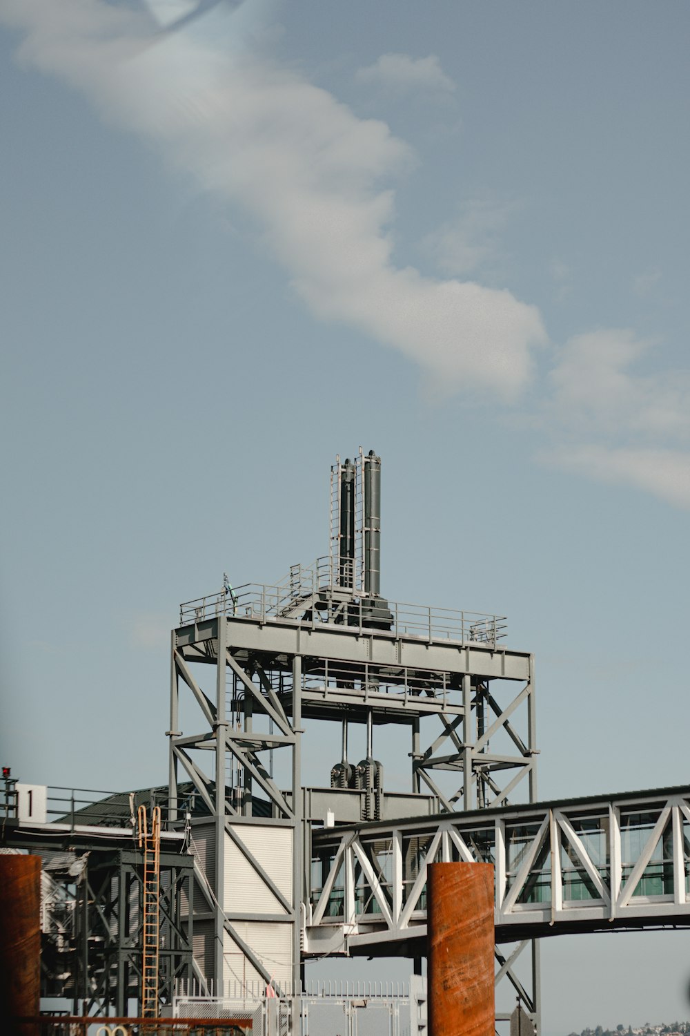 white and black metal tower under blue sky