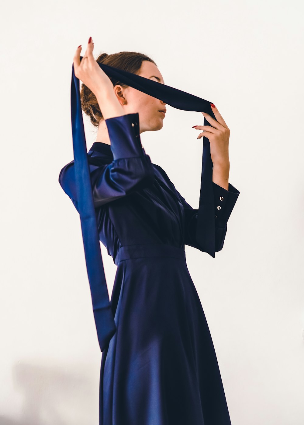 woman in blue long sleeve dress