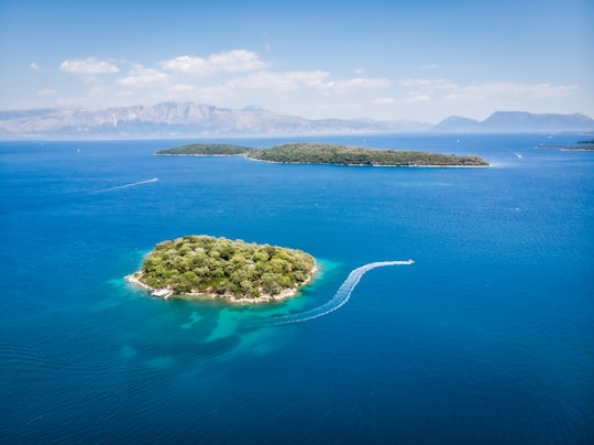 green island in the middle of blue sea in Lefkada Greece