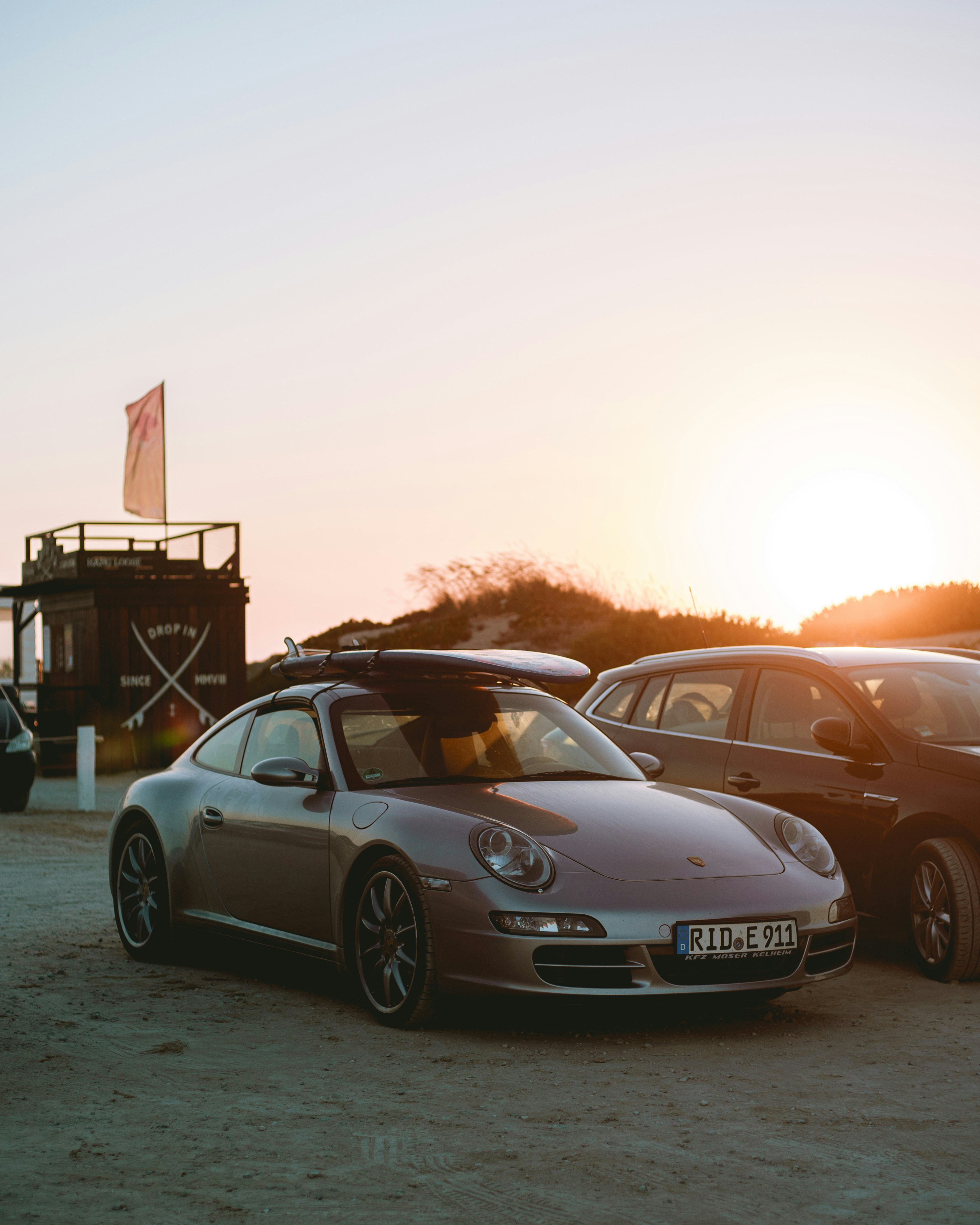 silver mercedes benz coupe on parking lot during daytime