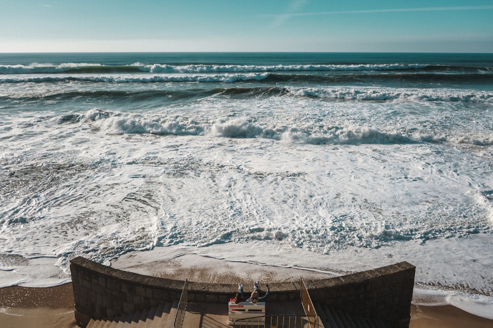 brown wooden dock on blue sea under blue sky during daytime