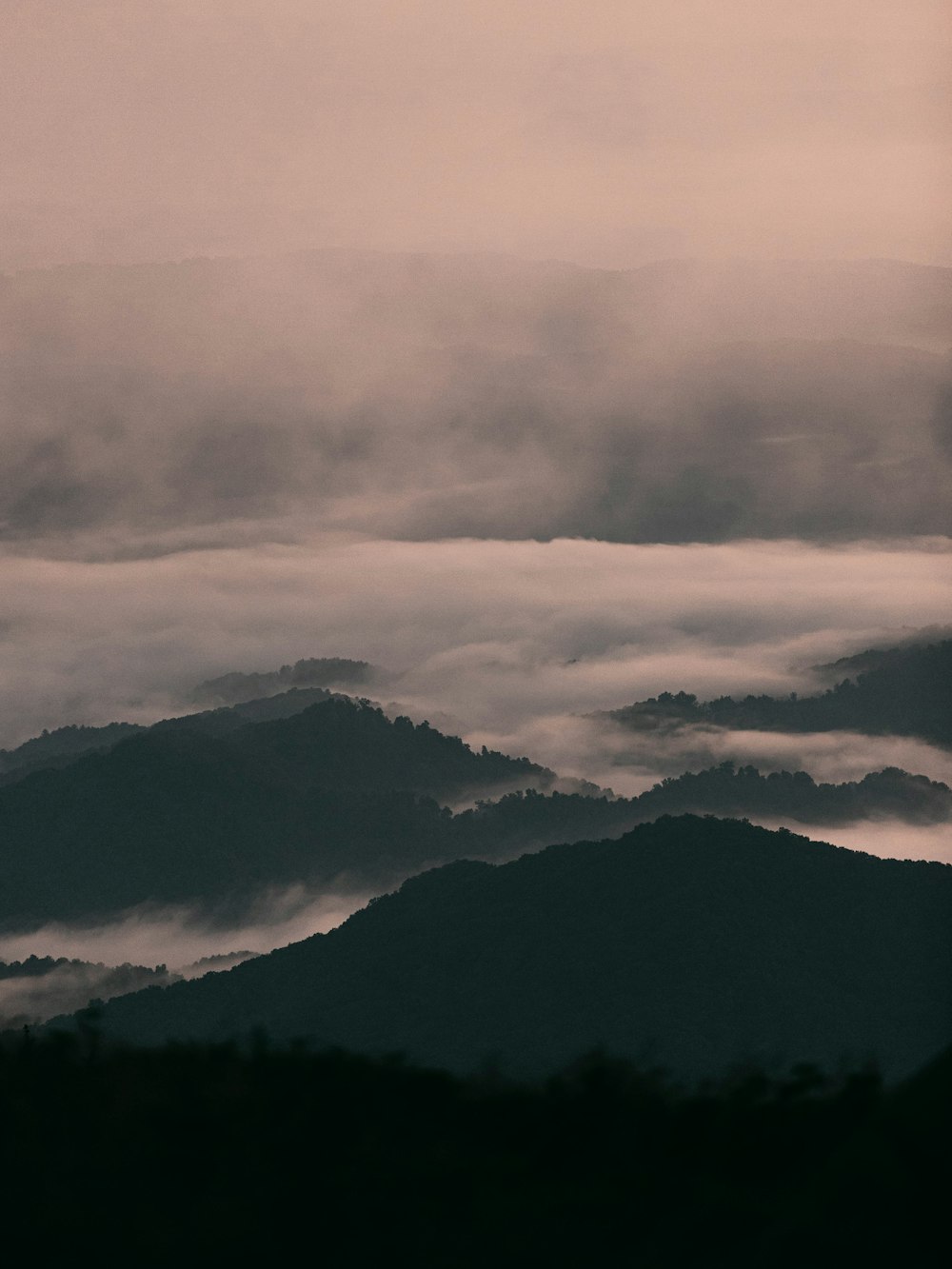 black mountains under white clouds