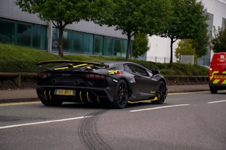 black porsche 911 parked on road during daytime