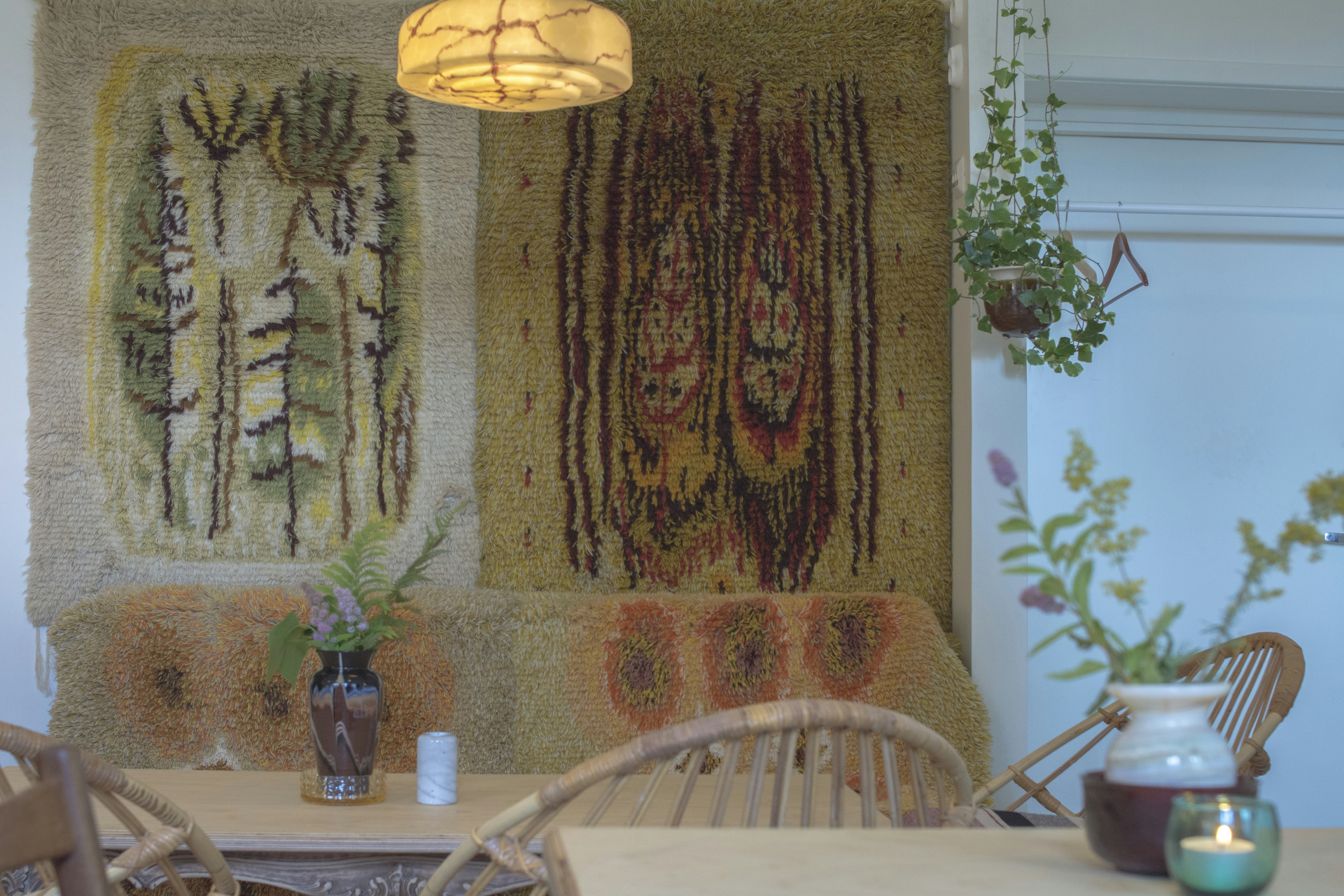 Cozy room decorated with fairy lights, plants, and wall art on a budget